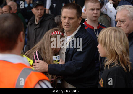 A young female football fan distressed by bad crowd behavior at Ninian Park stadium Cardiff City v Wolverhampton Wanderers 30/9/2006 Stock Photo