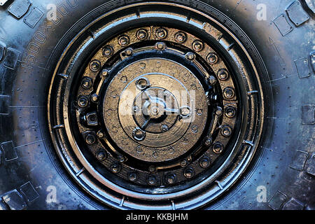 Close up of military vehicle wheel. Large off road tire abstract background. Stock Photo