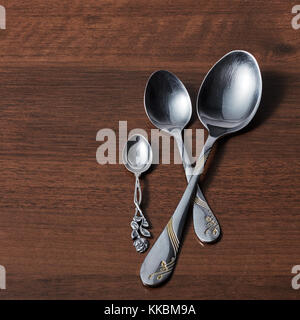 three spoons on a wooden background Stock Photo
