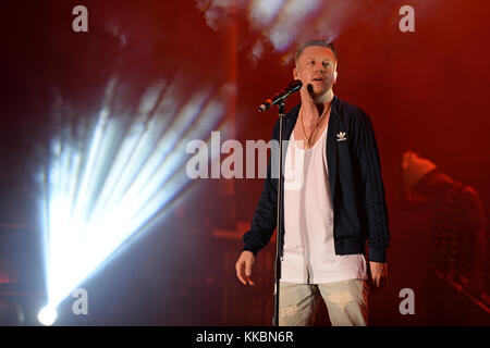 MIAMI BEACH, FL - DECEMBER 30: Macklemore performs during Orange Bowl Beach Bash on December 30, 2015 in Miami Beach, Florida.  People:  Macklemore Stock Photo