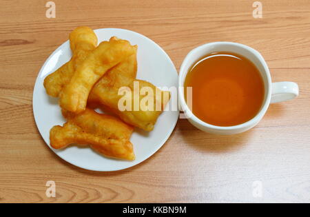 deep fried dough stick and tea cup Stock Photo