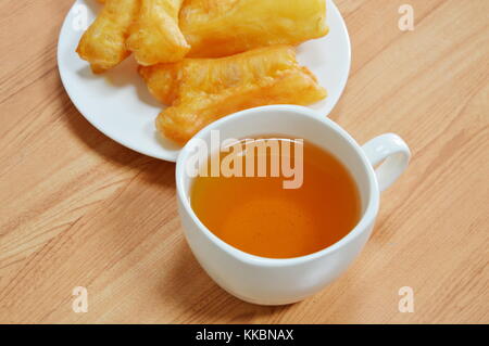 deep fried dough stick and tea cup Stock Photo