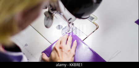 woman stitching a purse Stock Photo