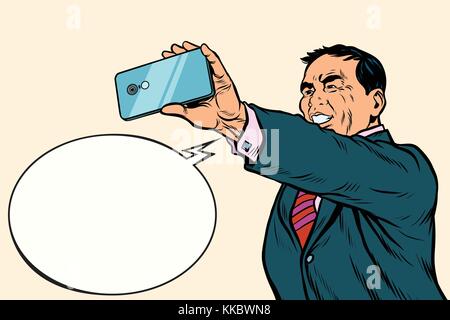 Asian businessman makes selfie. A picture of the phone. Pop art retro vector illustration Stock Vector