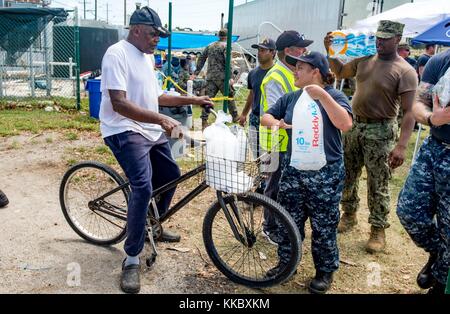 U.S. Navy sailors deliver emergency supplies to local residents during relief efforts in the aftermath of Hurricane Irma September 15, 2017 in Key West, Florida.  (photo by Shamira Purifoy via Planetpix) Stock Photo