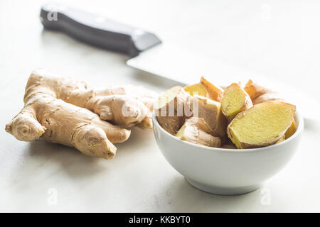 Sliced ginger root on table. Healthy ginger. Stock Photo