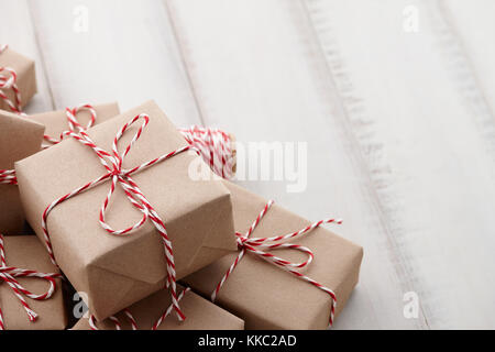 Christmas gift or present boxes wrapped in kraft paper Stock Photo