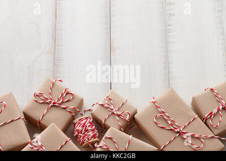 Christmas gift or present boxes wrapped in kraft paper Stock Photo