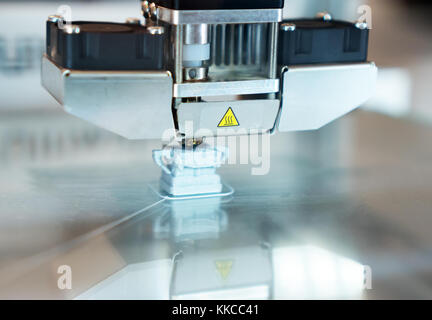 Head of industrial 3d printer in action. Stock Photo