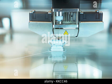 Head of industrial 3d printer in action. Stock Photo