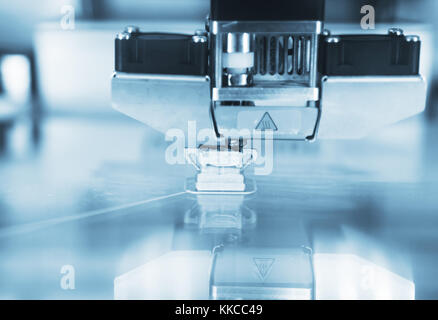 Head of industrial 3d printer in action. Stock Photo