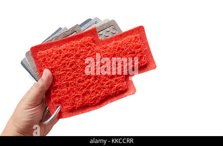 hand holding samples of pvc coil mat, Isolated on a white background. Stock Photo