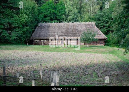 Reconstruction of old timber village in Folk Architecture Museum in Sanok – the biggest open-air museum in Poland Stock Photo