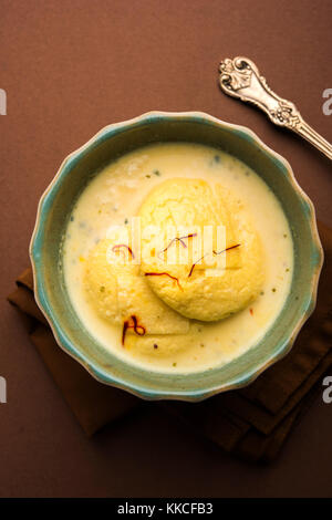 Ras malai or Rasmalai or rossomalai is Indian dessert food made using Jaggery or gur and sugar. It is a rich cheesecake without a crust Stock Photo