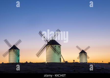 Illuminaed traditional windmills at rising, Campo de Criptana, Spain Stock Photo