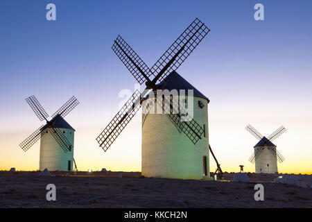 Illuminated traditional windmills at rising, Campo de Criptana, Spain Stock Photo