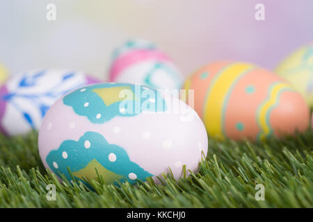 Closeup of colorful easter egg on grass Stock Photo