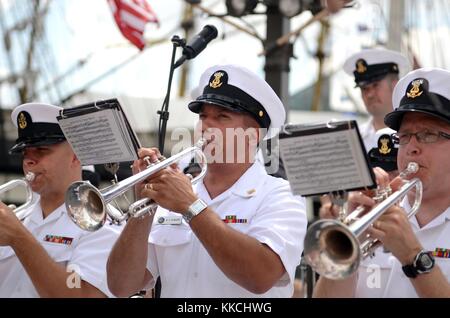Musician 1st Class Brandon Almagro, center, a trumpet instrumentalist with the US Navy Ceremonial Band, performs during the opening ceremony of the Star Spangled Sailabration at Baltimore's Inner Harbor during Baltimore Navy Week 2012, Baltimore, 2012. Image courtesy Chief Musician Stephen Hassay/US Navy. Stock Photo
