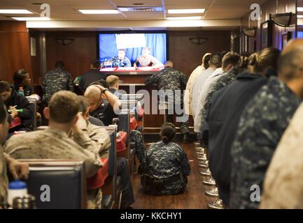 Sailors and Marines play bingo in the Carlson Cafe aboard the multi-purpose amphibious assault ship USS Makin Island LHD 8, Pacific Ocean, 2012. Image courtesy Mass Communication Specialist 2nd Class Dominique Pineiro/US Navy. Stock Photo