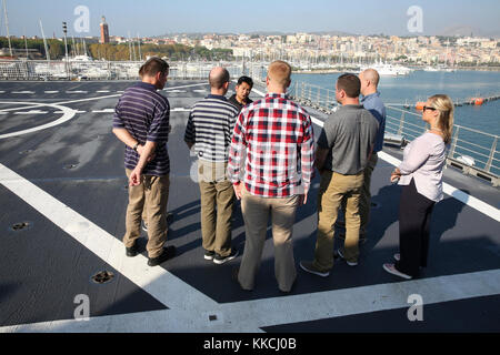 GAETA, Italy — Tuscan Trident participants receive a capabilities overview of Military Sealift Command Expeditionary Fast Transport Ship, USNS Carson City (T-EPF 7), during familiarization training. Reservists from Expeditionary Port Units (EPUs)104, 105, 106, 107 and the Europe and Africa Headquarters unit, recently traveled to Naples, Italy, to conduct the first EPU table top exercise in the U.S. 6th Fleet area of operations. (Photo by Matthew Montgomery, Military Sealift Command Europe and Africa/Released) Stock Photo