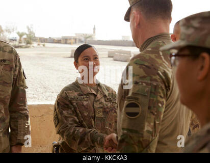 A U.S. Army Soldier, deployed in support of Combined Joint Task Force – Operation Inherent Resolve and assigned to the 458th Engineer Battalion, greets Gen. Robert Abrams, commanding general of U.S. Army Forces Command, at Camp Taji, Iraq, Nov. 16, 2017. Camp Taji is one of four CJTF-OIR building partner capacity locations dedicated to training partner forces and enhancing their effectiveness on the battlefield. CJTF-OIR is the global Coalition to defeat ISIS in Iraq and Syria. (U.S. Army photo by Cpl. Rachel Diehm) Stock Photo