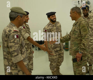 Lt. Gen. Michael Garrett, Commanding General of U.S. Army Central, tours the Qatari Land Force base following a meeting with Maj. Gen. Mohammed Al-Ghanem, Commander of Qatari Emiri Land Force. During his tour, Garrett visited various training facilities and spoke with the Qatari soldiers that operate the technology. (U.S. photo taken by Spc. Joshua P. Morris, U.S. ARCENT PAO) Stock Photo