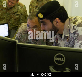 Lt. Gen. Michael Garrett, Commanding General of U.S. Army Central, tours the Qatari Land Force base following a meeting with Maj. Gen. Mohammed Al-Ghanem, Commander of Qatari Emiri Land Force. During his tour, Garrett visited various training facilities and spoke with the Qatari soldiers that operate the technology. (U.S. photo taken by Spc. Joshua P. Morris, U.S. ARCENT PAO) Stock Photo