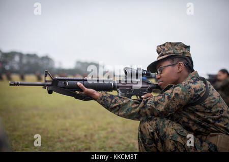 U.S. Marine Corps Rct. Kierra I. Jones of Platoon 4000, Oscar Company, 4th Recruit Training Battalion, practices her trigger squeeze Nov. 22, 2017, on Parris Island, S.C. For one week, recruits, like Jones, 18, from Chicago, practice the fundamentals of marksmanship, like slow, steady breathing and trigger control. Oscar Company is scheduled to graduate Jan. 5, 2018. Parris Island has been the site of Marine Corps recruit training since Nov. 1, 1915. Today, approximately 19,000 recruits come to Parris Island annually for the chance to become United States Marines by enduring 12 weeks of rigoro Stock Photo