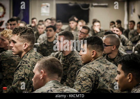 U.S. Marines with Fox Company, 2nd Battalion, 6th Marine Regiment, 26th Marine Expeditionary Unit (MEU), participate in a guided discussion as the culminating event of a Lance Corporal Seminar aboard the dock landing ship USS Oak Hill (LSD 51), during Combined Composite Training Unit Exercise (COMPTUEX) in the Atlantic Ocean Nov. 25, 2017. Combined COMPTUEX serves as the capstone event for the Amphibious Ready Group-MEU team prior to a deployment, fully integrating the ARG-MEU team as an amphibious force and testing their ability to execute missions across a range of military operations. (U.S. Stock Photo