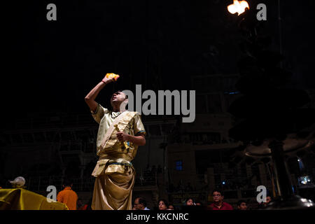 a young hindu priest during ganga aarti, Dashashwamedh Ghat by the river Ganges Stock Photo