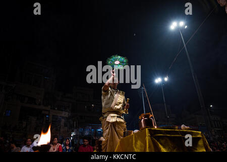 a young hindu priest during ganga aarti, Dashashwamedh Ghat by the river Ganges Stock Photo