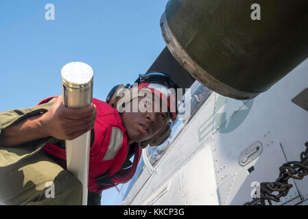 ATLANTIC OCEAN (Nov. 28, 2017) Marine Cpl. Austin McClure from Rome, Georgia, assigned to Marine Medium Tiltrotor Squadron (VMM) 162 (Reinforced) places a rocket on an H-1W Cobra on the flight deck aboard the amphibious transport dock ship USS New York (LPD 21). New York, components of the Iwo Jima Amphibious Ready Group and the 26th Marine Expeditionary Unit are conducting a Combined Composite Training Unit Exercise that is the culmination of training for the Navy-Marine Corps team and will certify them for deployment. (U.S. Navy photo by Mass Communication Specialist 2nd