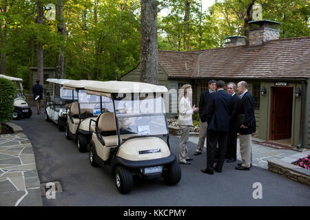 President Barack Obama talks with Liz Sherwood-Randall, Senior Director for European Affairs, Chief of Staff Jack Lew, Mike Froman, Deputy National Security Advisor for International and Economic Affairs, and National Security Advisor Tom Donilon, outside Aspen Cabin at the conclusion of the G8 Summit at Camp David, Md., May 19, 2012. (Official White House Photo by Pete Souza)  This official White House photograph is being made available only for publication by news organizations and/or for personal use printing by the subject(s) of the photograph. The photograph may not be manipulated in any  Stock Photo