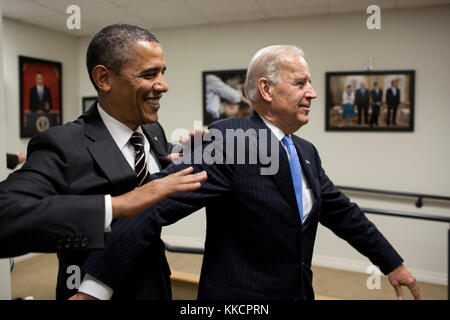President Barack Obama jokes with Vice President Joe Biden backstage before the STOCK Act signing event in the Eisenhower Executive Office Building South Court Auditorium, April 4, 2012. (Official White House Photo by Pete Souza)  This official White House photograph is being made available only for publication by news organizations and/or for personal use printing by the subject(s) of the photograph. The photograph may not be manipulated in any way and may not be used in commercial or political materials, advertisements, emails, products, promotions that in any way suggests approval or endors Stock Photo