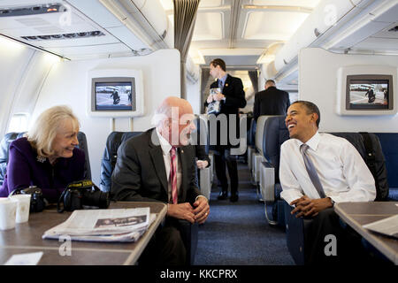 President Barack Obama talks with Sen. Patrick Leahy, D-VT, and Marcelle Leahy aboard Air Force One en route to Burlington, Vt., March 30, 2012. Stock Photo