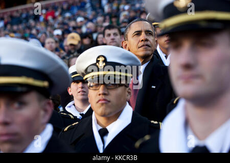 President Barack Obama watches the first half of the annual Army vs. Navy football game with U.S. Naval Academy Midshipman at FedEx Field in Landover, Md., Saturday, Dec. 10, 2011. Stock Photo