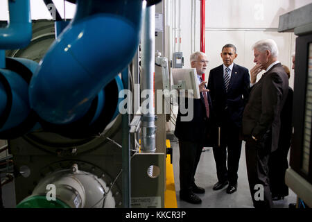 President Barack Obama and former President Bill Clinton listen as Gary Le Francois, Senior Vice President and Director of Engineering, leads them on a tour of the Transwestern Building in Washington, D.C., Dec. 2, 2011. The 240,000 square foot office building is undergoing renovations to the façade and internal systems that are expected to raise their ENERGY STAR rating to 95 (out of 100). Stock Photo