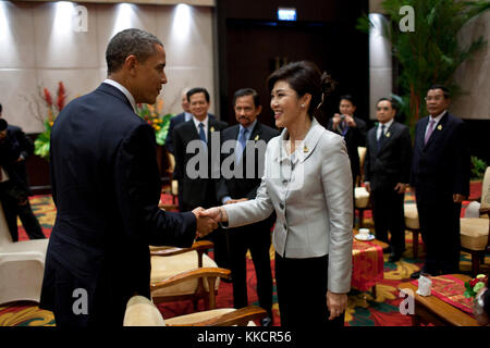 President Barack Obama greets Prime Minister Yingluck Shinawatra of Thailand during the ASEAN Summit in Nusa Dua, Bali, Indonesia, Nov. 18, 2011. Stock Photo