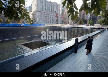 Sept. 11, 2011  President and First Lady, along with former President George W. Bush and former First Lady Laura Bush, paused at the North Memorial Pool of the National September 11 Memorial in New York City. The North Memorial pool sits in the footprint of the north tower, formerly 1 World Trade Center. Stock Photo