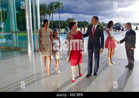 March 19, 2011 'The late afternoon light was bouncing off the glass and steel at the Palacio do Alvorada in Brasilia, Brazil, as the President and his family arrived to greet Brazilian President Dilma Rousseff and foreign Minister Antonio Patriota. I was backpedaling as I made this picture and in retrospect wish that I had taken this at a lower angle.' Stock Photo