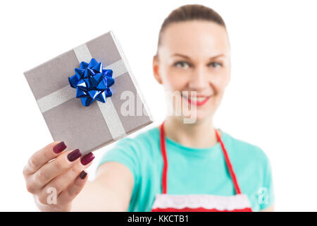 Housekeeper or maid showing the gift box she received from the landlord Stock Photo