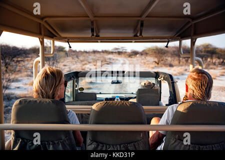 Couple on Game Drive in Onguma Game Reserve, Namibia, Africa Stock Photo