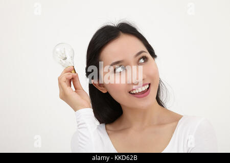 malay woman holding light bulb Stock Photo