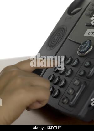 hand pressing key on the phone Stock Photo
