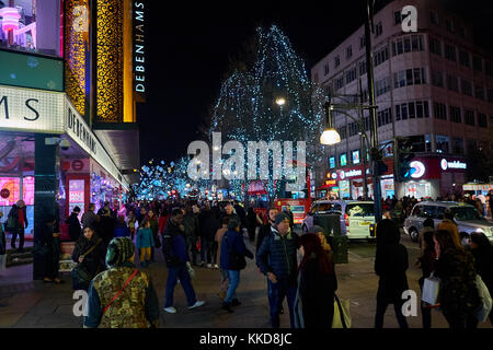 LONDON CITY - DECEMBER 24, 2016: People walking up and down Oxford Street with lots of Christmas decorations Stock Photo