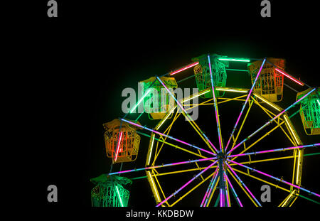 ferris wheel with neon light at night carnival park Stock Photo