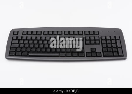 Plain black Qwerty keyboard on an off-white background. Metaphor for Darkweb, cybercrime, data privacy concept, ghost brokers. Stock Photo