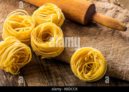 Homemade pasta on a wooden background Stock Photo