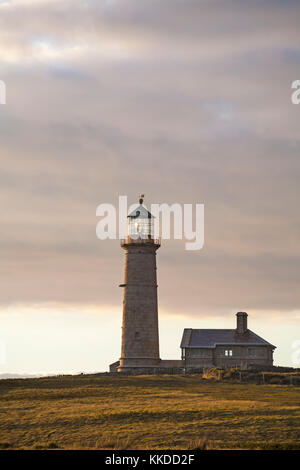 Old Light lighthouse and Old Light Cottage on Lundy Island, Devon, England UK in August Stock Photo