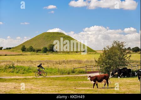 Silbury Hill artificial Neolithic prehistoric chalk mound outside village of Avebury, Wiltshire England. 4750 years old 40m high Stock Photo